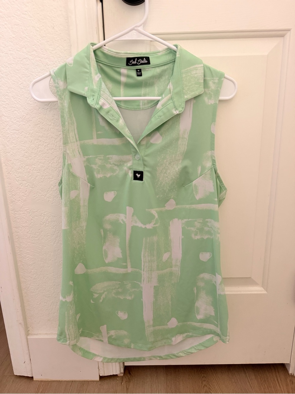 Women’s bad birdie green sleeveless polo